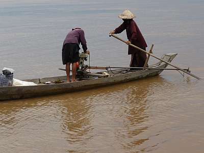 Vietnamese in a fishing boat