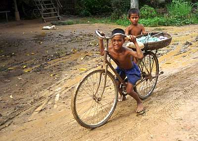 Two boys with a bicycle