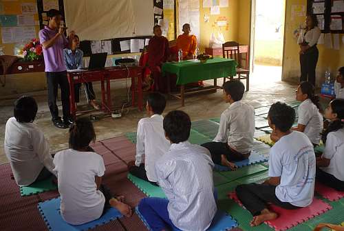 A monk making a presentation