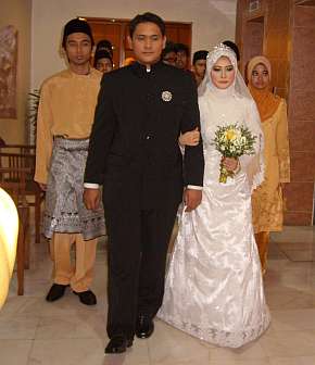 A Malay couple processing to their weddiing