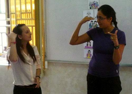 Sign language teacher and student
