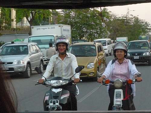 Two deaf staff on motorcycles