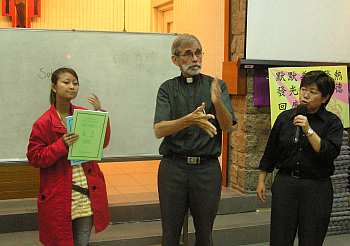 Sokchea explaining the Cambodian sign language books