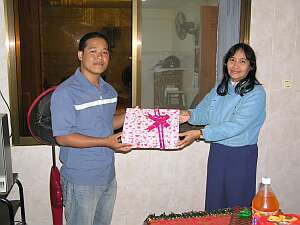 Seila receiving a gift from Chap Kimhoeung